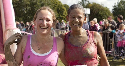 Two girls covered in mud