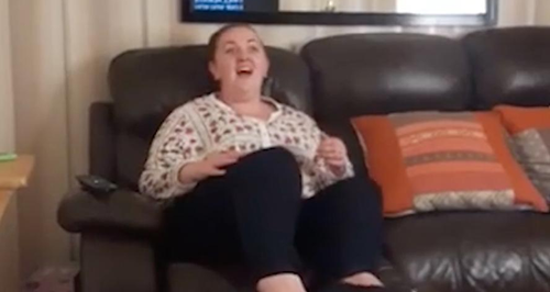 Mum singing on the sofa